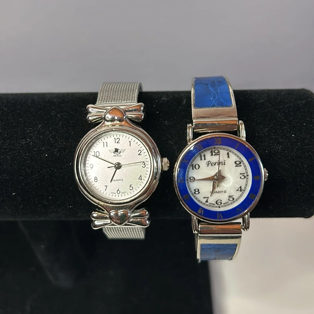 Two vintage quartz watches one stainless steel with hearts one with blue trim